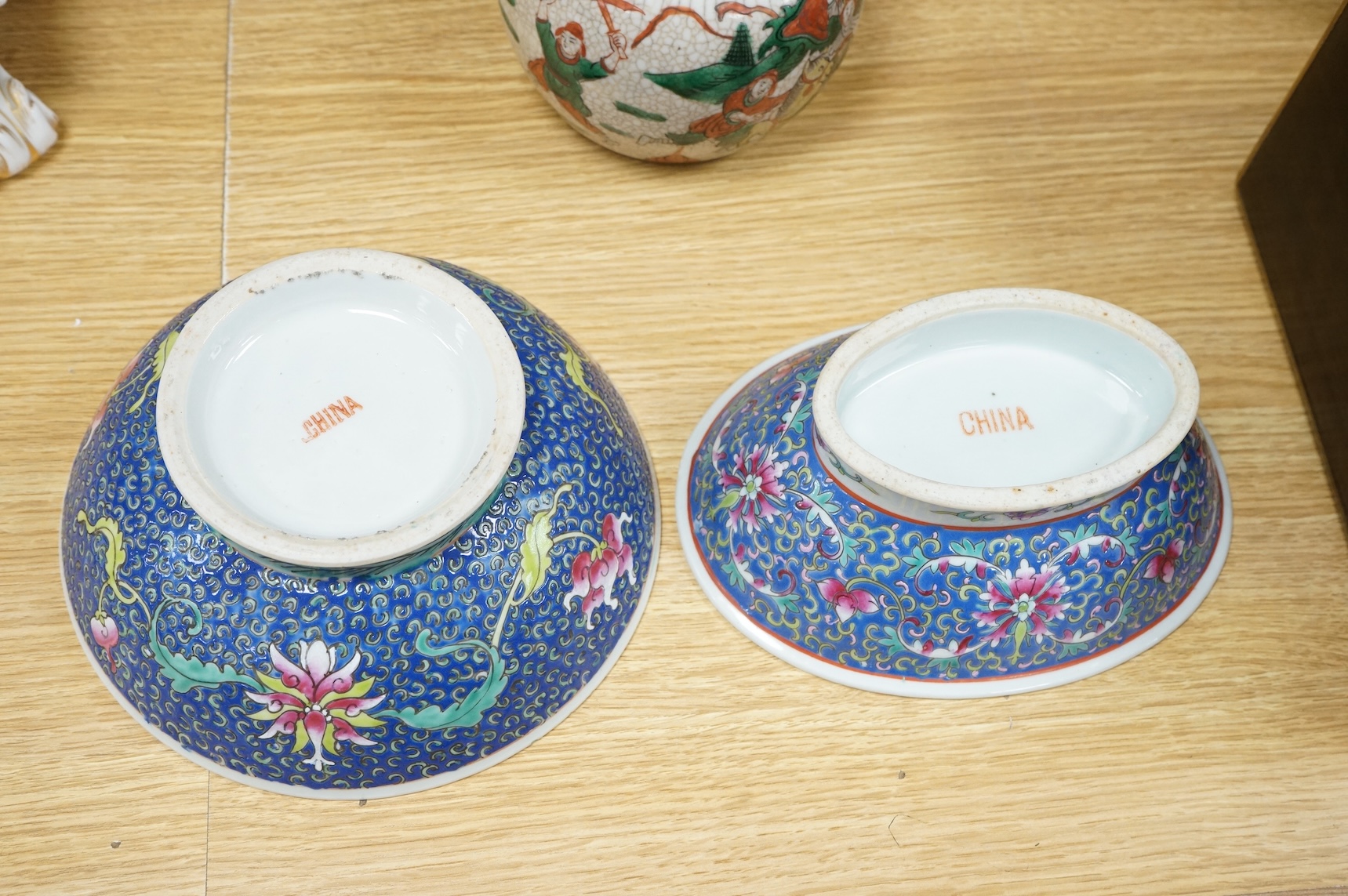 Three Chinese crackleglaze 'Warriors' jars without covers and two Chinese enamelled porcelain bowls. Largest bowl 20cm diameter.